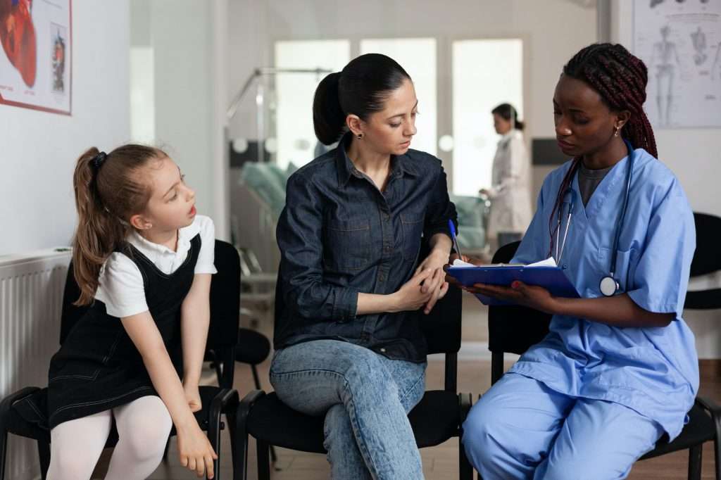 Family with caring nurse